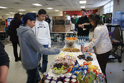 picture of parent volunteer at a snack booth