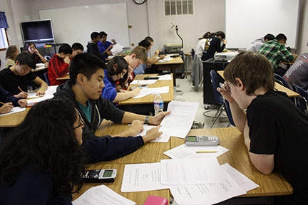 picture of students taking partner statistics test